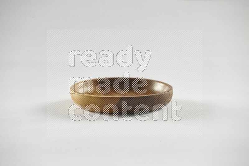 A wooden bowl on white background