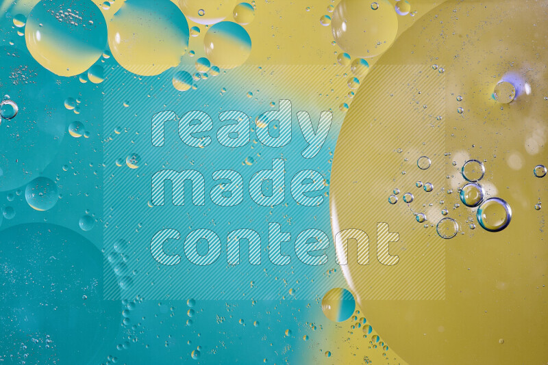 Close-ups of abstract oil bubbles on water surface in shades of blue and yellow