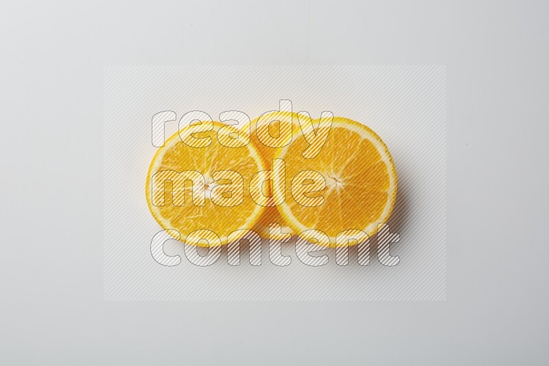 Three orange slices on a white background