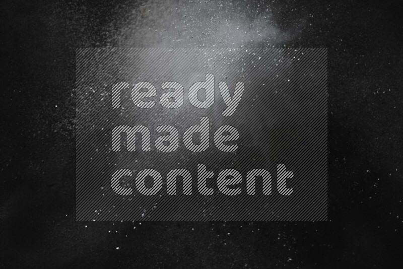 White powder explosion on black background