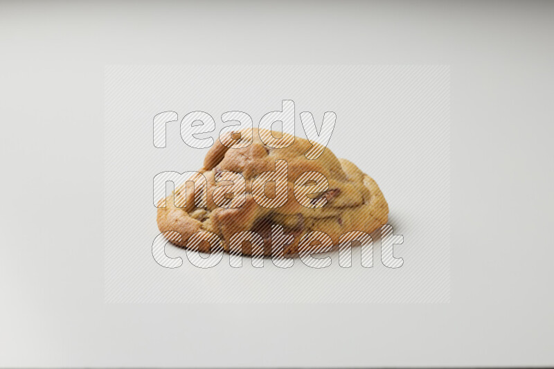 a chocolate chip cookie on a white background