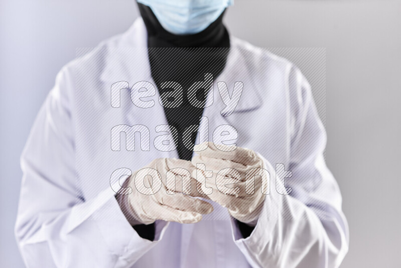 Female doctor wearing an abaya and medical attire in different positions
