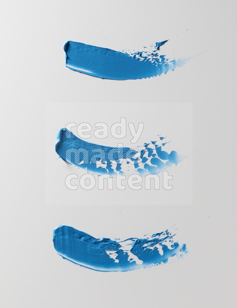 Blue painting knife strokes on white background