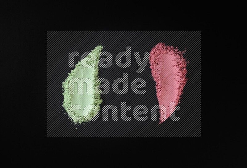 Multicolored powder smears on black background