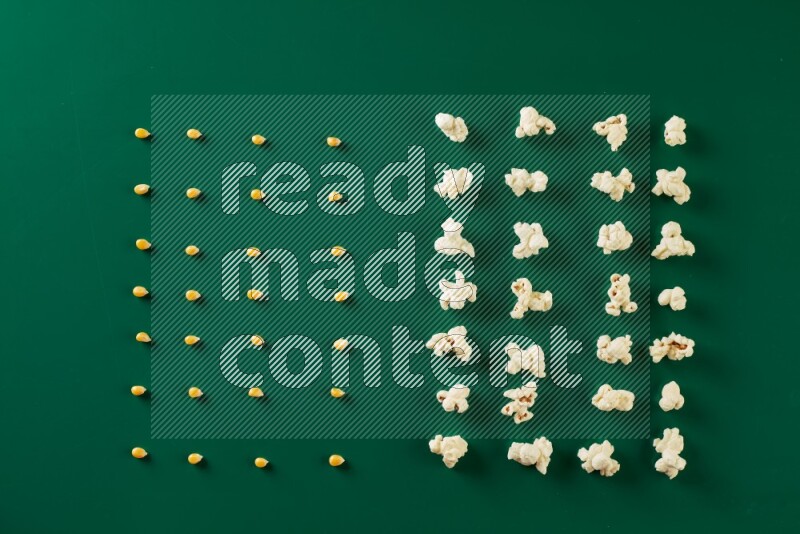 Popcorn flakes and seeds on a green background in a top view shot