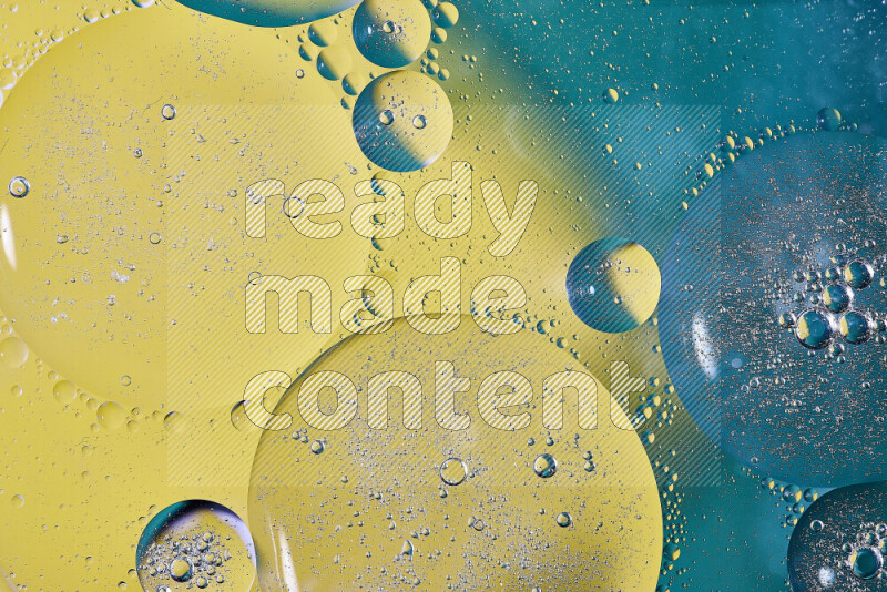 Close-ups of abstract oil bubbles on water surface in shades of green and yellow