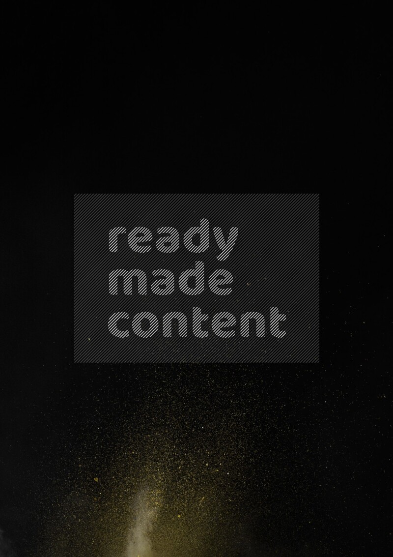 A side view of yellow powder explosion on black background