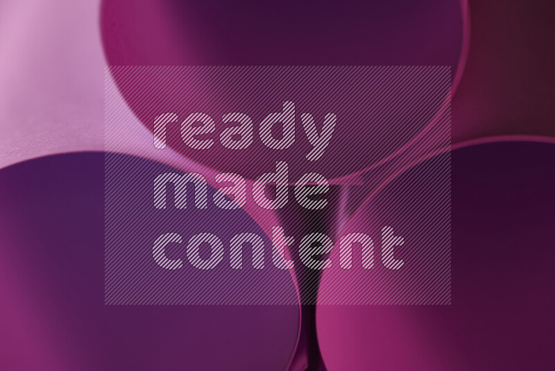 The image shows an abstract paper art with circular shapes in varying shades of pink