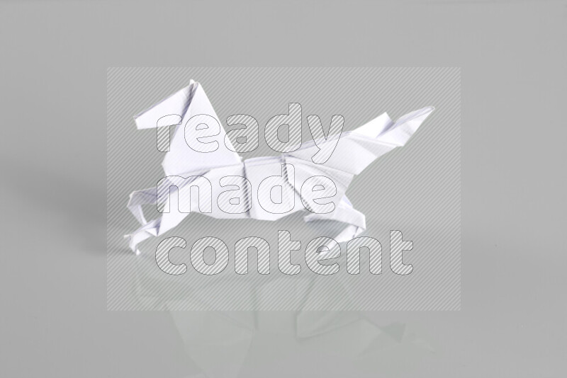 Origami animals on grey background