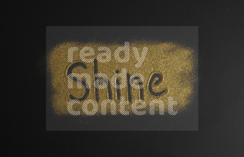 A word written with gold glitter on black background
