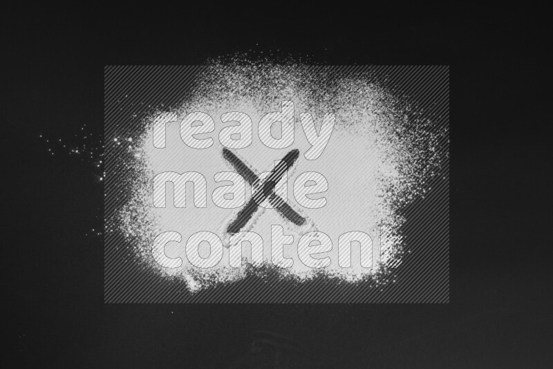 Alphabets written with powder on black background