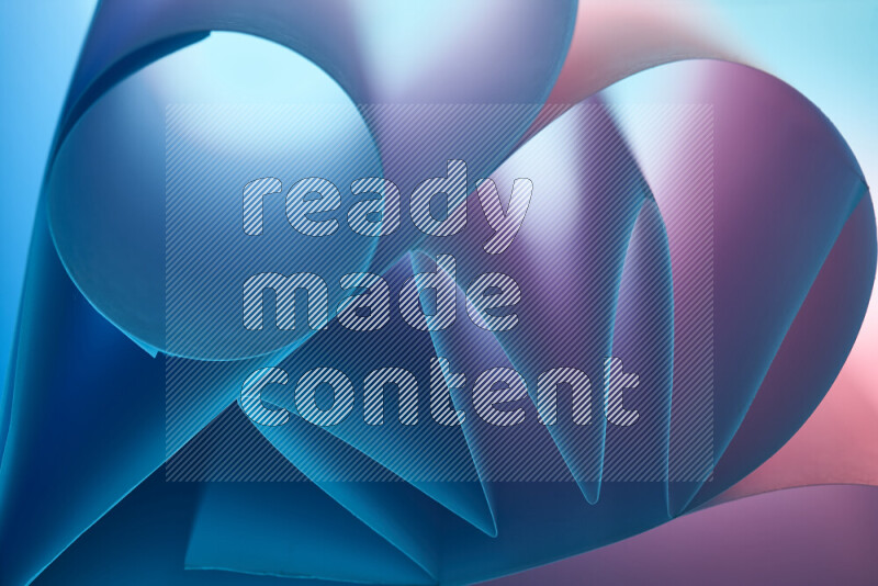 An artistic display of paper folds creating a harmonious blend of geometric shapes, highlighted by soft lighting in blue and pink tones