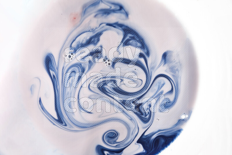 A close-up of abstract swirling patterns in blue, red and white