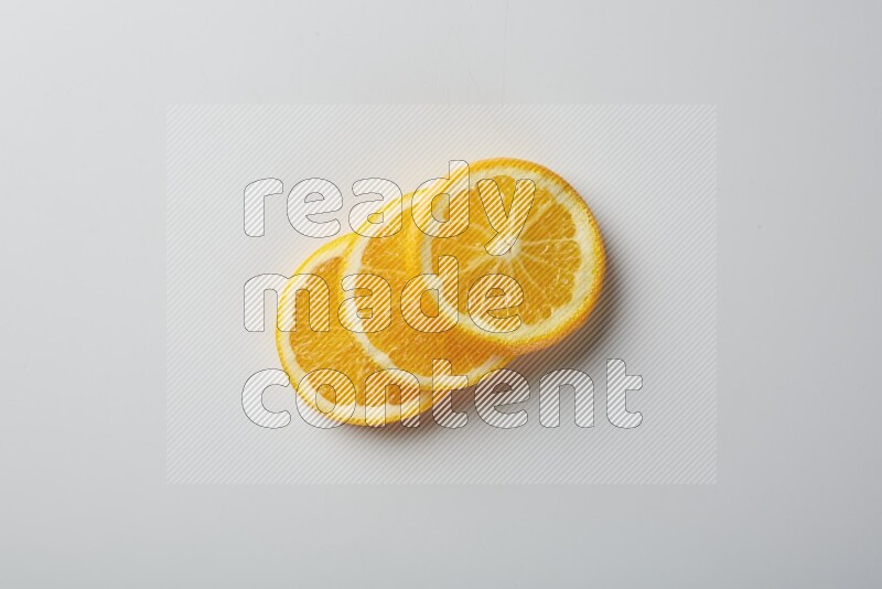 Three orange slices on a white background