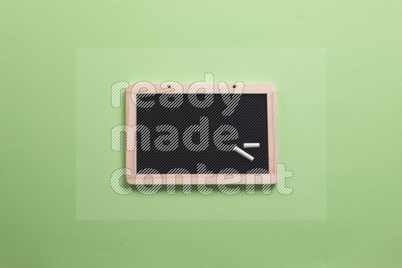 A blackboard on green background