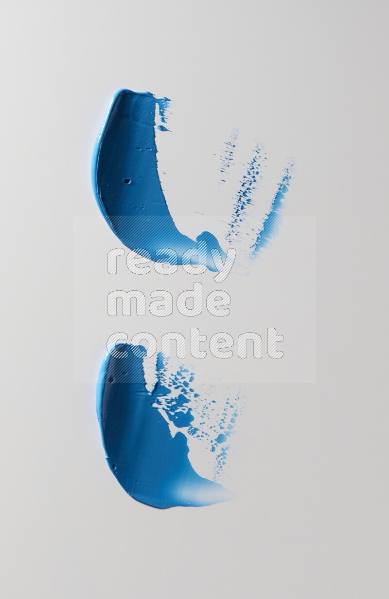 Blue painting knife strokes on white background