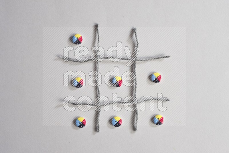 Multicolored buttons placed on grey background