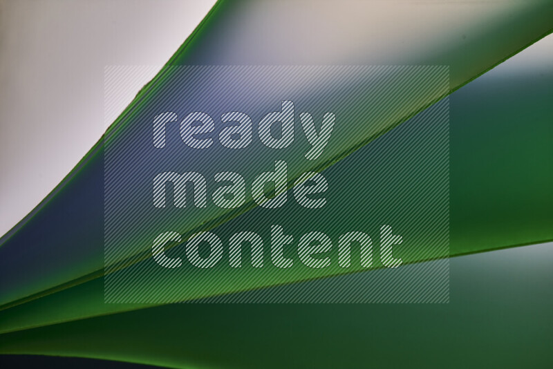 An abstract art piece displaying smooth curves in cold gradients created by colored light