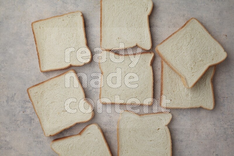 White Toast slices on alight blue textured background