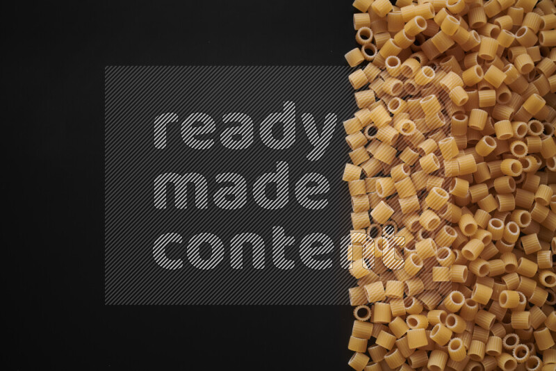 Different pasta types on black background