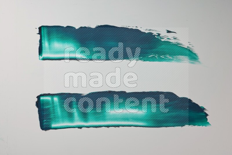Turquoise painting knife strokes on white background