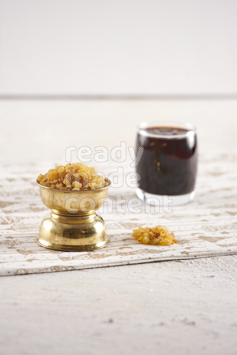 Dried fruits in a metal bowl with tamarind in a light setup