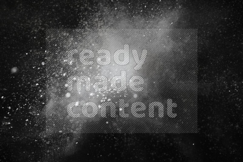 White powder explosion on black background