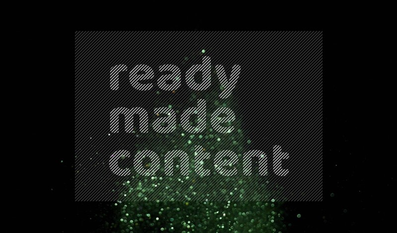 Green glitter powder isolated on black background