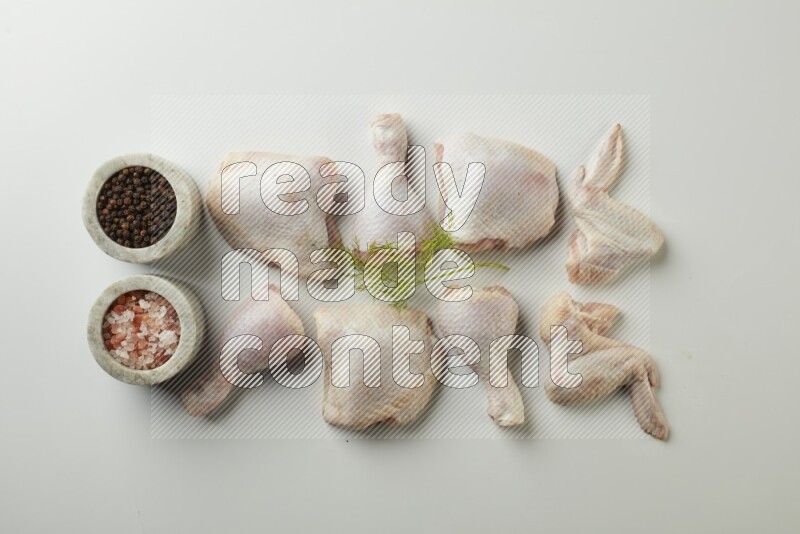 Mixed fresh chicken pieces direct on a white background