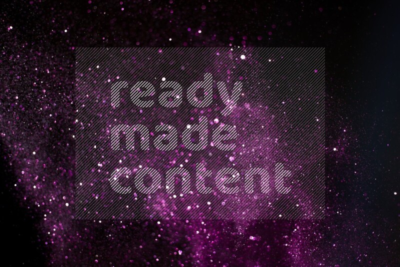 Pink glitter powder isolated on black background