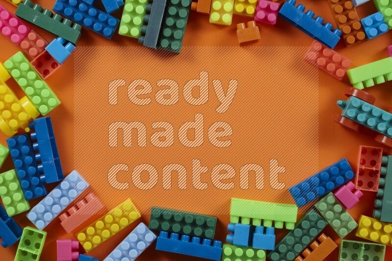 Multicolored plastic building blocks on different backgrounds (kids toys)