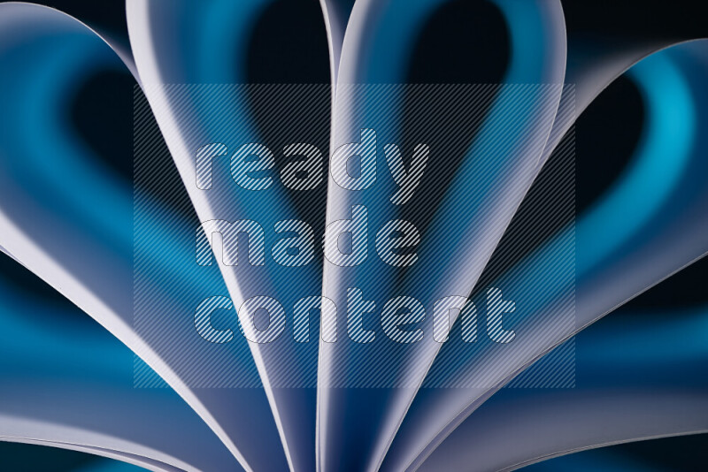 An abstract art piece displaying smooth curves in white and blue gradients created by colored light