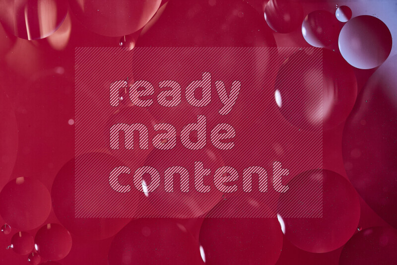 Close-ups of abstract oil bubbles on water surface in shades of white and red