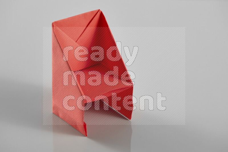 Origami dinning room on grey background