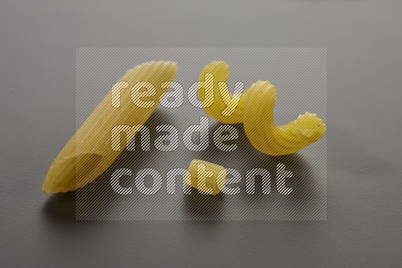Different pasta types on grey background
