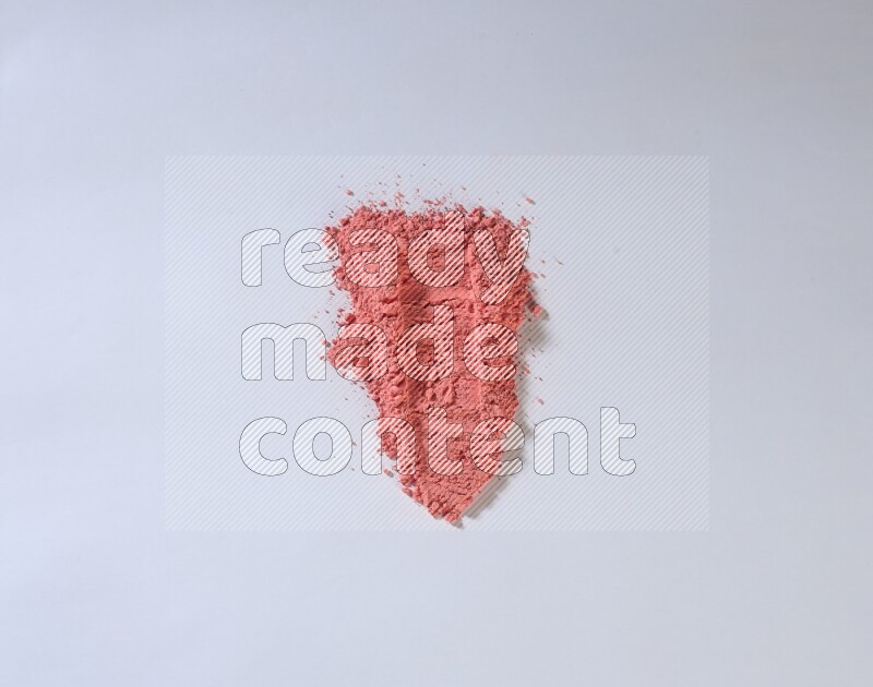 Red powder smears on white background