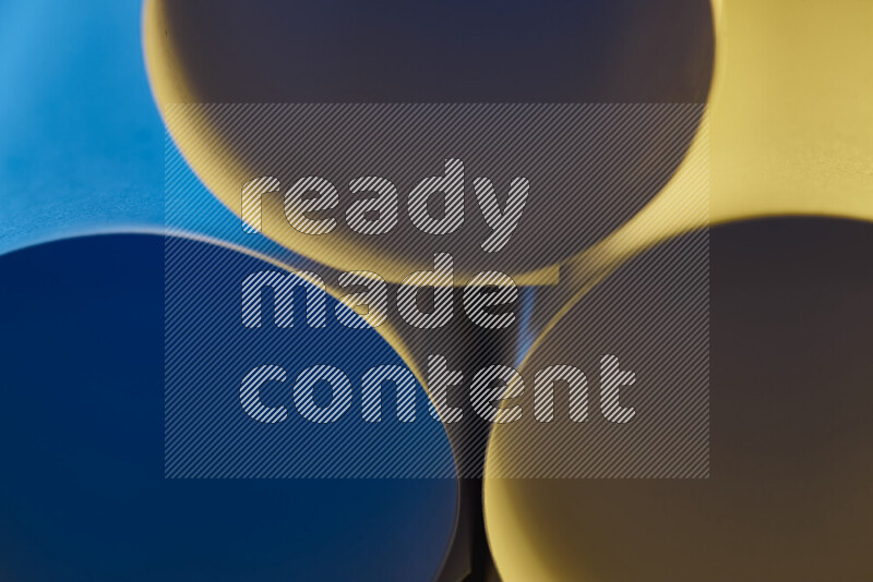 The image shows an abstract paper art with circular shapes in varying shades of blue and warm tones