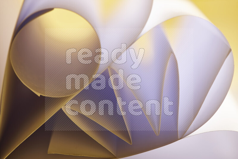 An artistic display of paper folds creating a harmonious blend of geometric shapes, highlighted by soft lighting in white and gold tones