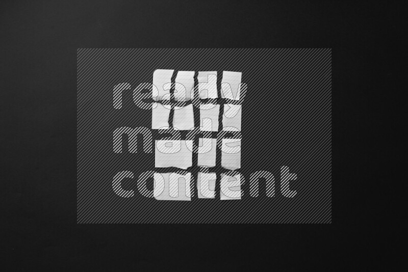 Ripped notebook sheet on black background