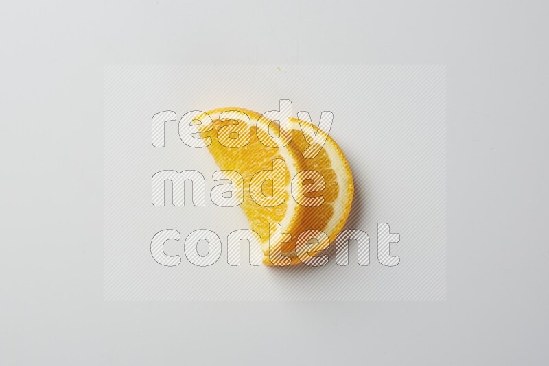 Two halves of an orange slices on white background