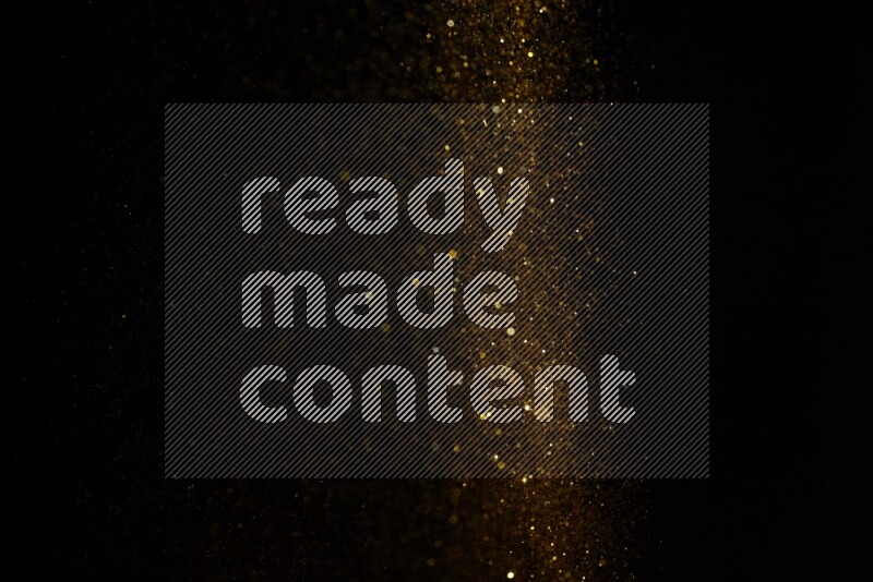 Gold glitter powder isolated on black background