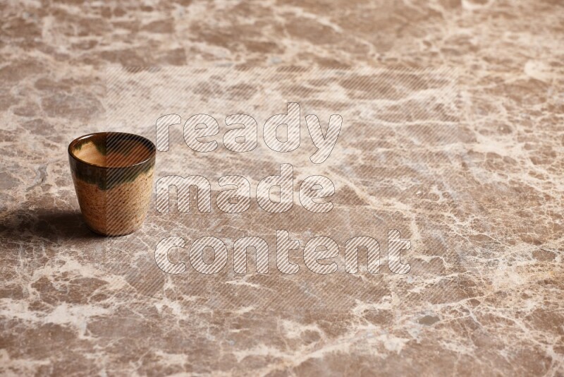 Pottery Cup on Beige Marble Flooring