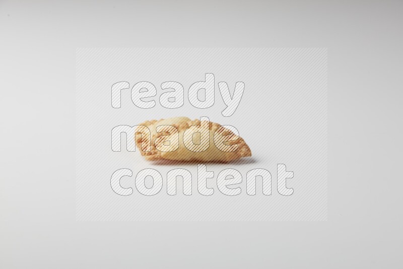 Two fried sambosas on a white background