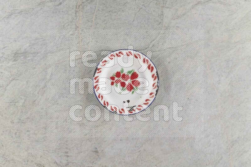 A vintage metal plate on grey marble background