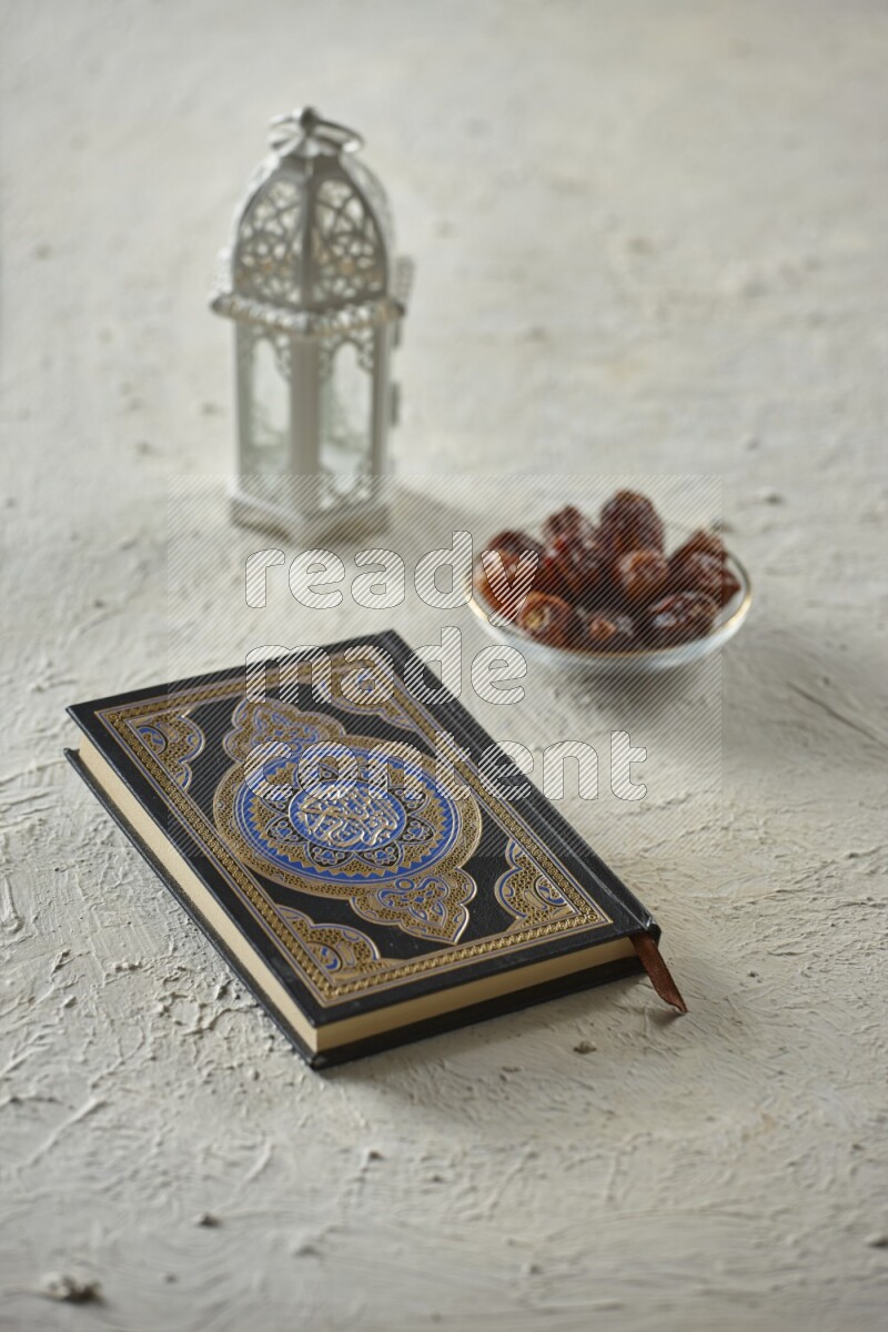 A white lantern with different drinks, dates, nuts, prayer beads and quran on white background
