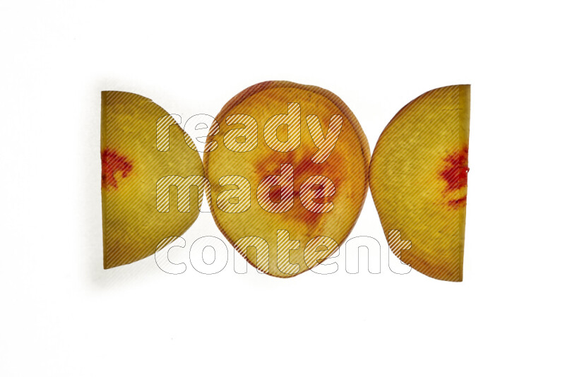 Peach slices on illuminated white background
