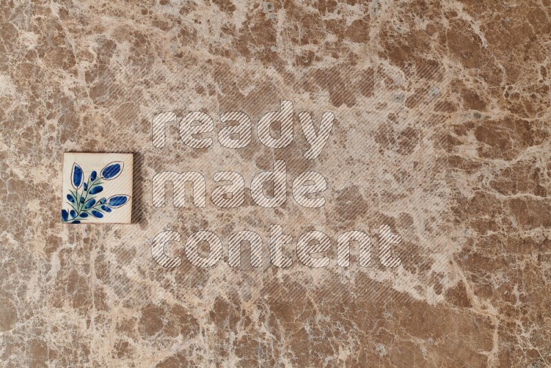 A decorative coaster on beige marble background