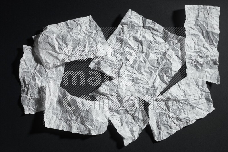White paper sheet on black background