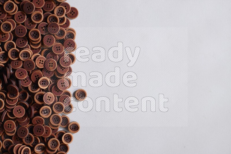 Wooden buttons placed on grey background