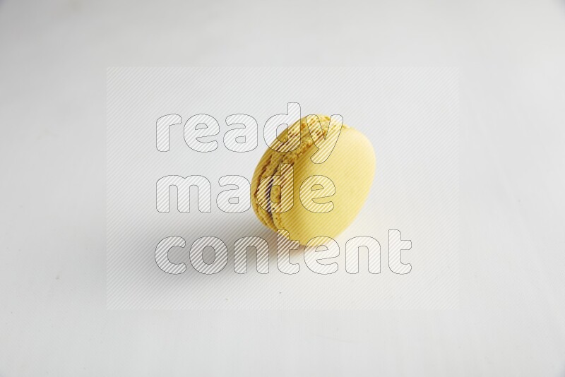 45º Shot of Yellow Lemon macaron on white background